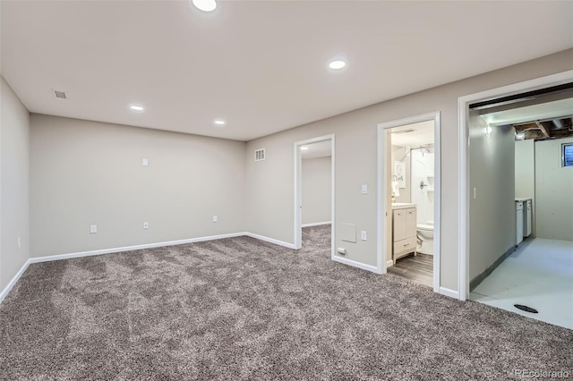 unfurnished bedroom with recessed lighting, visible vents, carpet flooring, connected bathroom, and baseboards