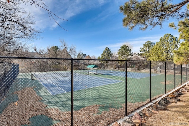 view of sport court with fence