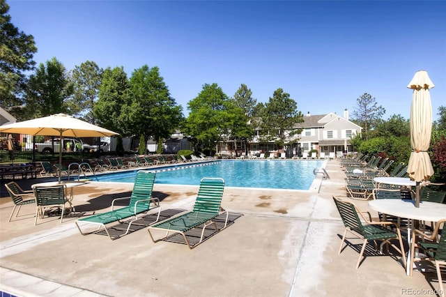 pool featuring a patio area and fence