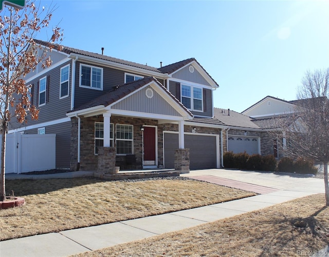 view of front of home featuring a porch and a garage