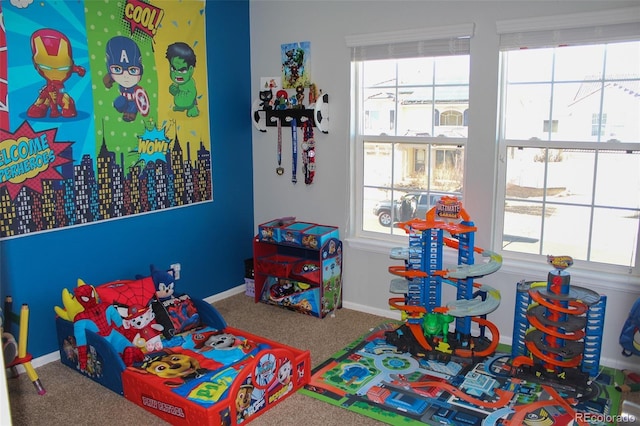 game room featuring plenty of natural light and carpet