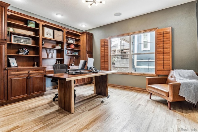 office area with light hardwood / wood-style flooring