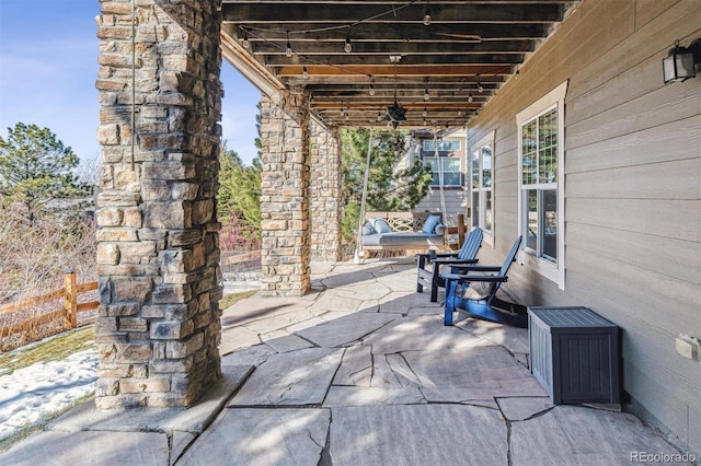 view of patio featuring ceiling fan