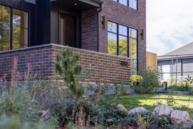 3362 W 32nd Ave, Denver, CO 80211 - view of side of property with brick siding and board and batten siding