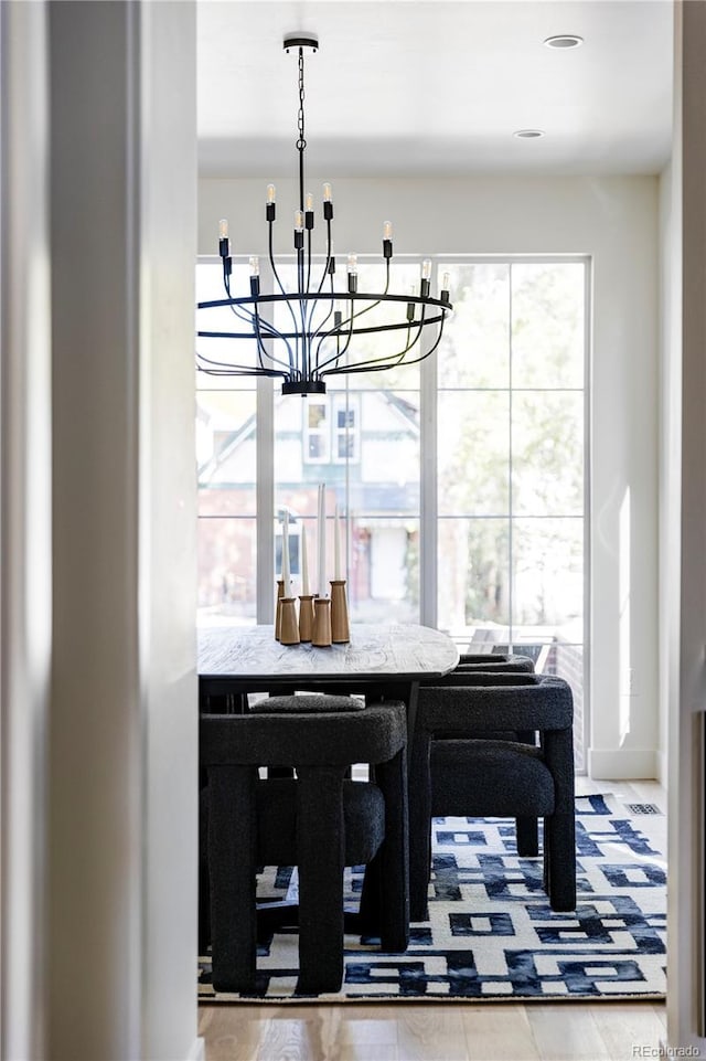 3362 W 32nd Ave, Denver, CO 80211 - dining room with a chandelier and healthy amount of natural light