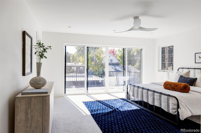 carpeted bedroom with access to outside and ceiling fan