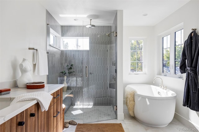 bathroom featuring vanity, separate shower and tub, and tile patterned flooring