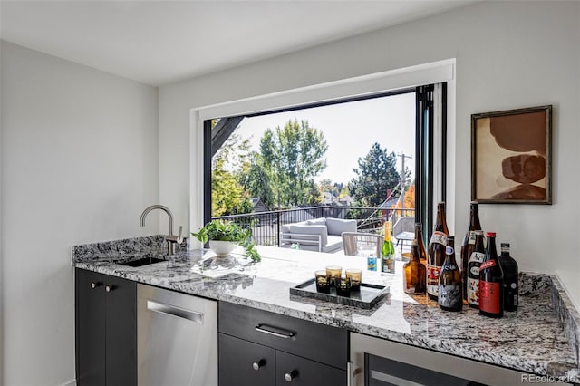 kitchen with stainless steel dishwasher, sink, wine cooler, and light stone counters