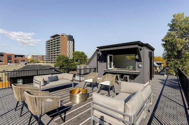 wooden terrace with outdoor lounge area