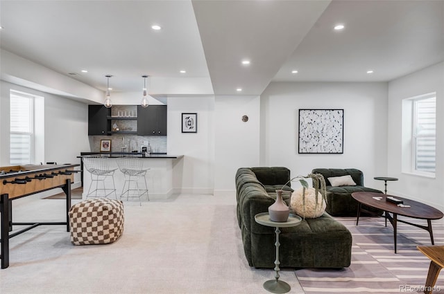 3362 W 32nd Ave, Denver, CO 80211 - living area with bar with sink, recessed lighting, light carpet, and baseboards