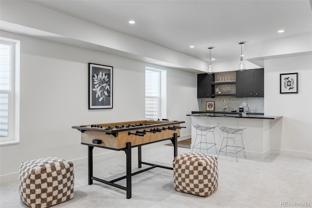 playroom featuring light colored carpet and indoor bar