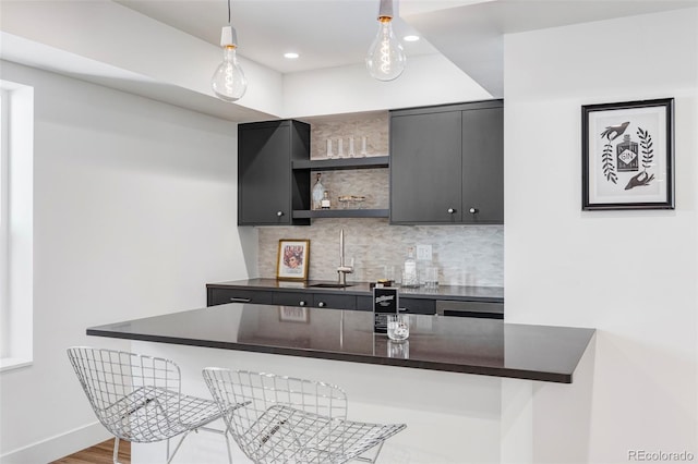 3362 W 32nd Ave, Denver, CO 80211 - bar featuring decorative backsplash, pendant lighting, a sink, recessed lighting, and baseboards