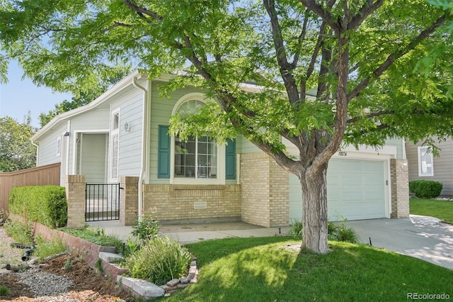 10231 Spotted Owl Ave, Highlands Ranch, CO 80129 - obstructed view of property with brick siding and driveway
