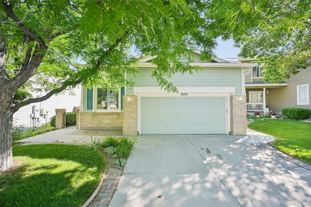 10231 Spotted Owl Ave, Highlands Ranch, CO 80129 - view of front of house featuring brick siding, concrete driveway, a front yard, and a garage