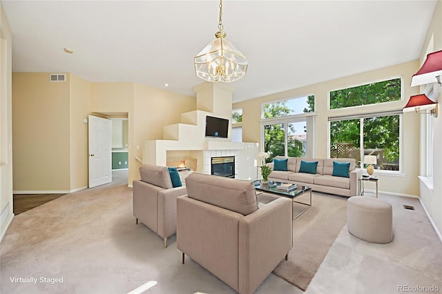 10231 Spotted Owl Ave, Highlands Ranch, CO 80129 - living room featuring light carpet, a chandelier, and a tile fireplace