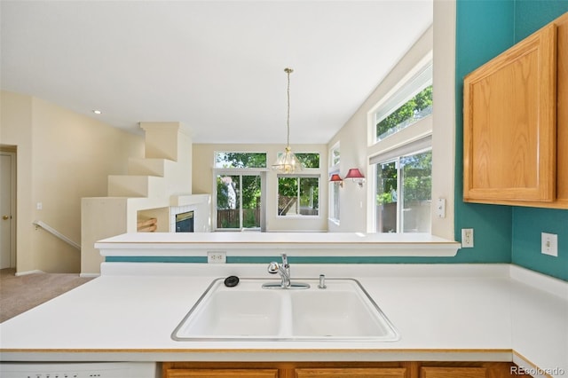 10231 Spotted Owl Ave, Highlands Ranch, CO 80129 - kitchen with light countertops, pendant lighting, and dishwasher