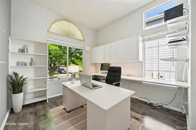 10231 Spotted Owl Ave, Highlands Ranch, CO 80129 - office area featuring dark wood finished floors and a high ceiling