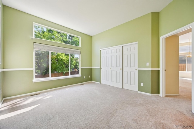 10231 Spotted Owl Ave, Highlands Ranch, CO 80129 - unfurnished bedroom with multiple windows, carpet, and a closet