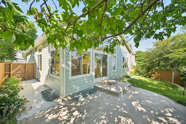 10231 Spotted Owl Ave, Highlands Ranch, CO 80129 - view of home's exterior featuring a patio area and a fenced backyard