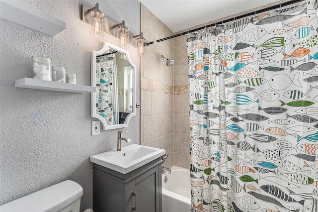 full bath with shower / tub combo, a textured wall, vanity, and toilet