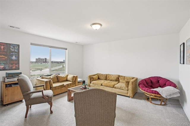 living area featuring light colored carpet and visible vents