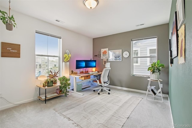 home office featuring baseboards, carpet flooring, and visible vents