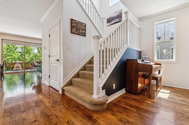 8695 E 49th Pl, Denver, CO 80238 - staircase with hardwood / wood-style floors and ornamental molding