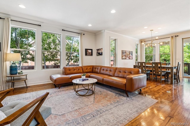 8695 E 49th Pl, Denver, CO 80238 - living room with ornamental molding, recessed lighting, and hardwood / wood-style floors