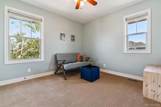 8695 E 49th Pl, Denver, CO 80238 - living area with carpet floors and ceiling fan