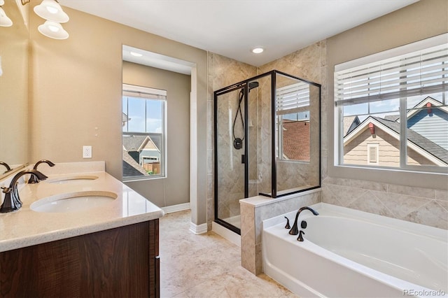 8695 E 49th Pl, Denver, CO 80238 - bathroom with a bath, a shower stall, and double vanity