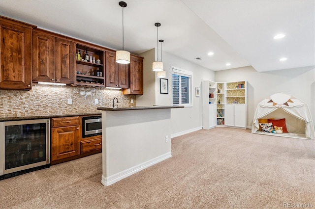 8695 E 49th Pl, Denver, CO 80238 - indoor wet bar with beverage cooler, light colored carpet, backsplash, stainless steel microwave, and decorative light fixtures