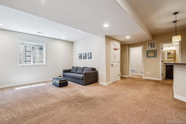 8695 E 49th Pl, Denver, CO 80238 - living area featuring light carpet and recessed lighting
