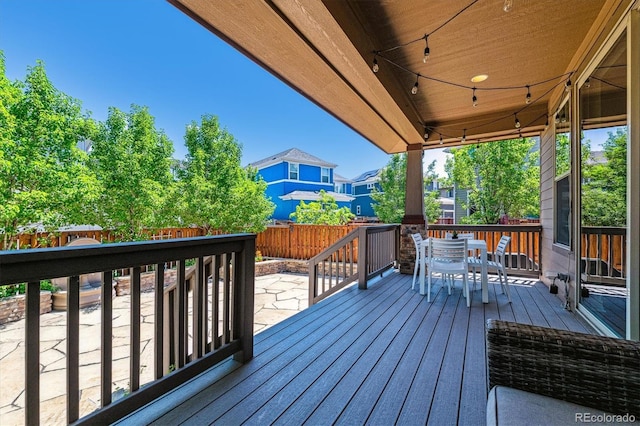8695 E 49th Pl, Denver, CO 80238 - wooden terrace featuring outdoor dining space, a fenced backyard, and a residential view