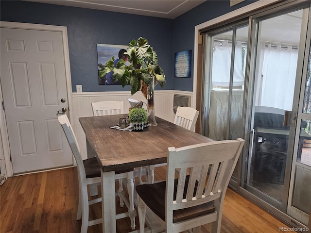 12375 W 19th Pl, Lakewood, CO 80215 - dining area featuring a wainscoted wall and light wood-style floors