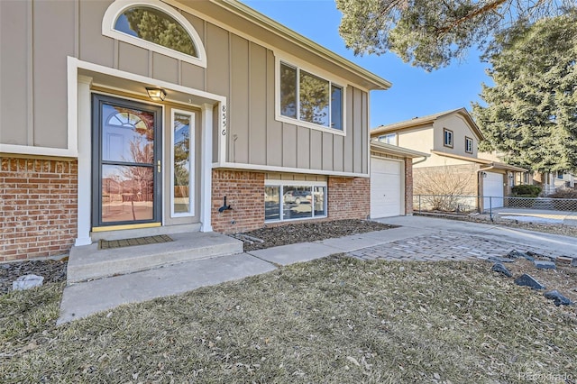 doorway to property featuring a garage