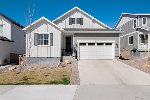 view of front facade with board and batten siding, a garage, and driveway