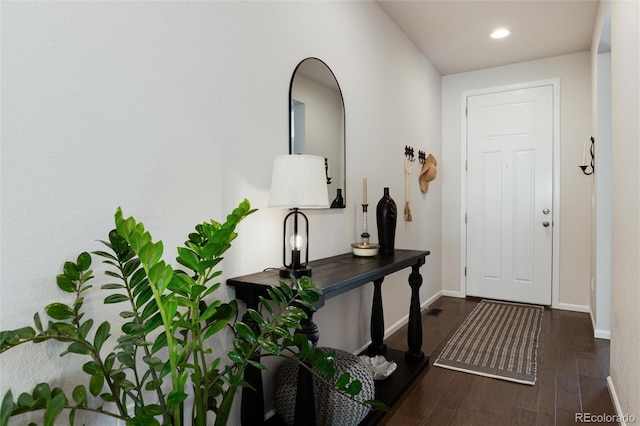 entryway with recessed lighting, visible vents, baseboards, and wood finished floors