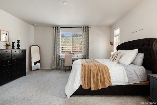 bedroom with carpet flooring and baseboards