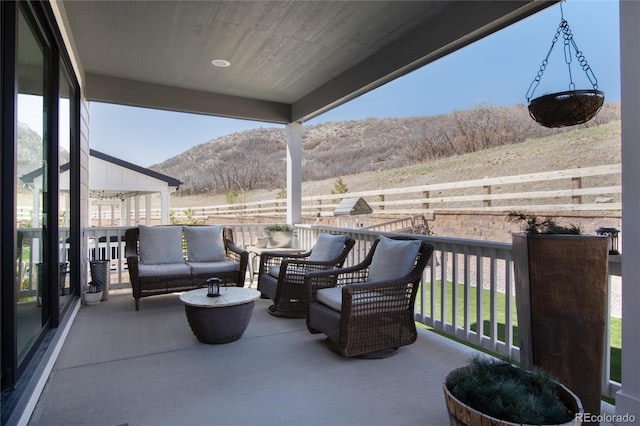 view of patio / terrace featuring a mountain view and outdoor lounge area