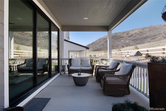balcony featuring outdoor lounge area and a mountain view