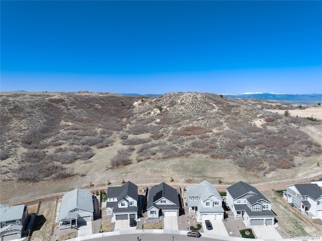drone / aerial view with a mountain view and a residential view