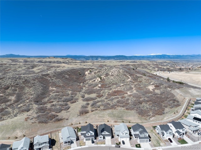 drone / aerial view with a residential view and a mountain view
