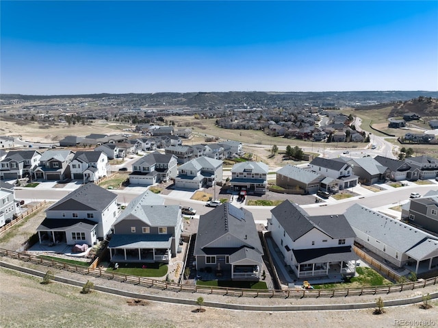 birds eye view of property with a residential view