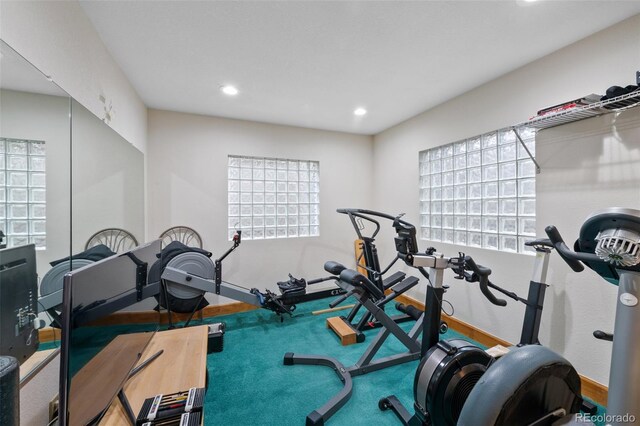 exercise area with baseboards and recessed lighting