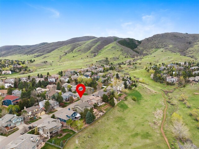 birds eye view of property with a mountain view and a residential view