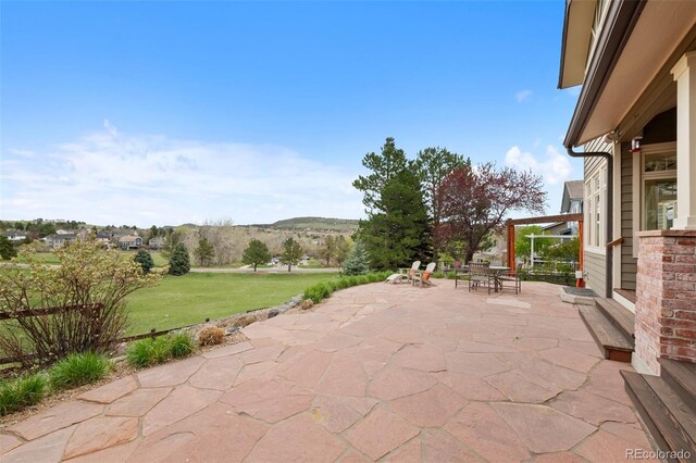 view of patio featuring a mountain view and outdoor dining area