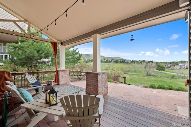 9 Amaranth Dr, Littleton, CO 80127 - deck with a lawn and a mountain view