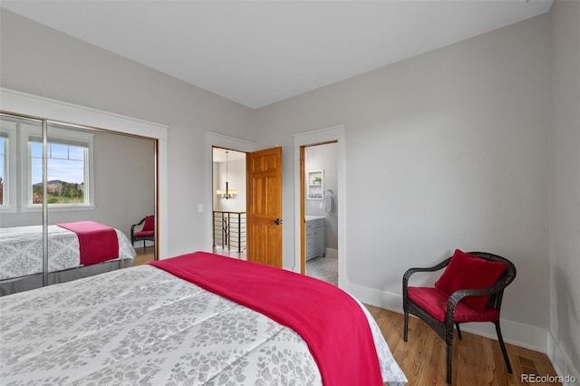 9 Amaranth Dr, Littleton, CO 80127 - bedroom with wood finished floors and ensuite bath