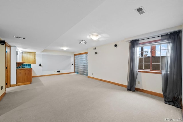 9 Amaranth Dr, Littleton, CO 80127 - below grade area with baseboards and light colored carpet
