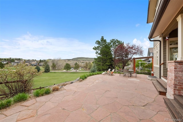 9 Amaranth Dr, Littleton, CO 80127 - view of patio / terrace featuring outdoor dining space and a mountain view